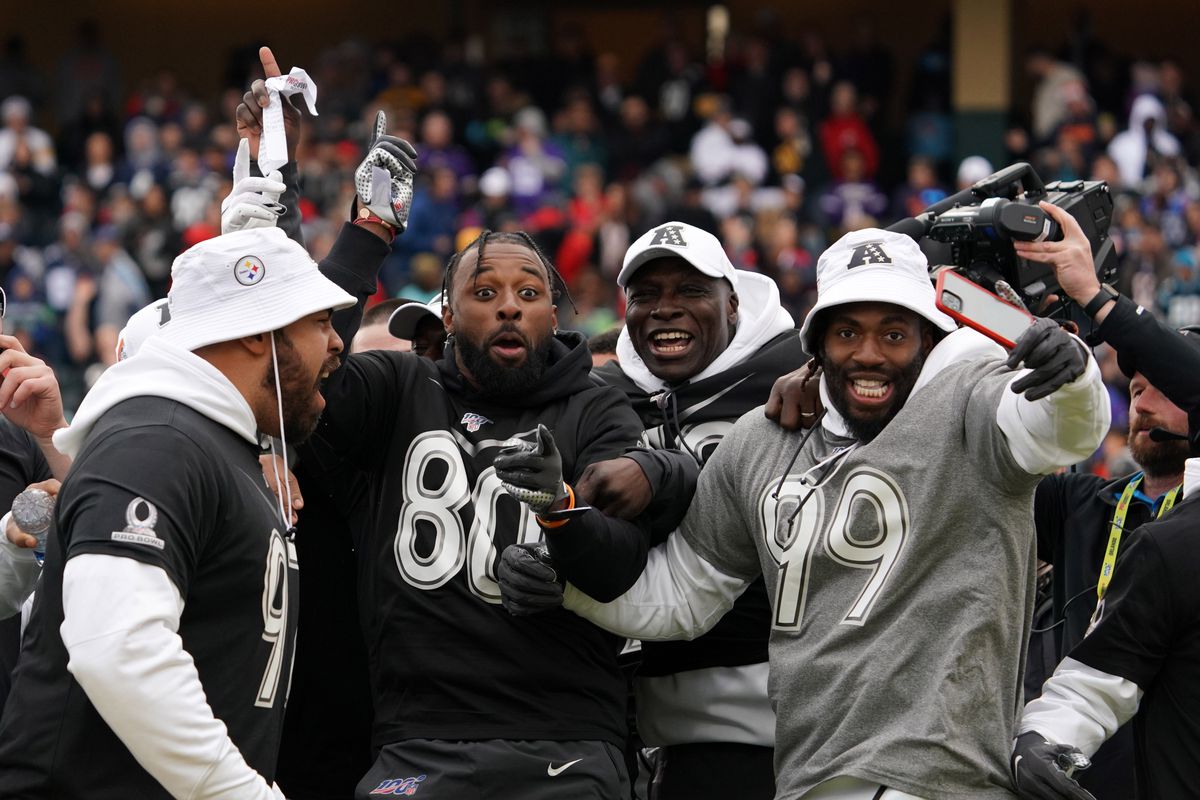 Cleveland Browns receiver Jarvis Landry (80) celebrates with Pittsburgh Steelers defensive tackle Cameron Hayward (97), Houston Texans tackle Laremy Tunsil (78) and Baltimore Ravens linebacker Matthew Judon (99) during the dodgeball competition at the Pro Bowl Skills Showdown at ESPN Wide World of Sports.