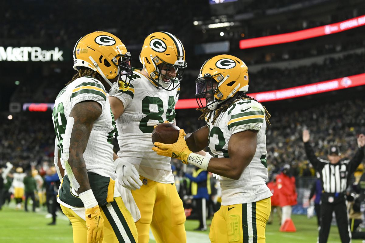Green Bay Packers running back Aaron Jones (33) celebrates with teammates after scoring a touchdown during the second half against the Baltimore Ravens at M&amp;amp;T Bank Stadium.