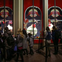People view candy ornaments during an unveiling celebration for the Macy's holiday candy windows at the City Creek Center in Salt Lake City on Thursday, Nov. 17, 2016.