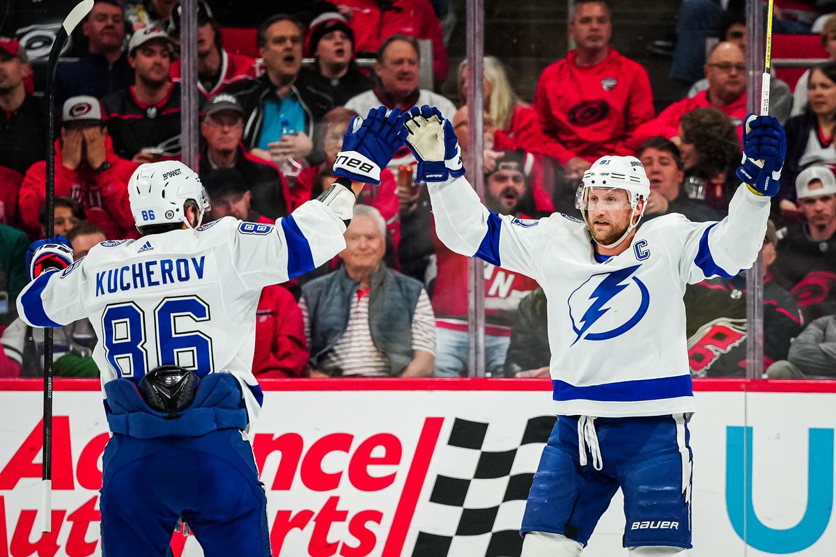 Steven Stamkos and Nikita Kucherov of the Tampa Bay Lightning celebrate a goal during the second period against the Carolina Hurricanes at PNC Arena on March 28, 2023 in Raleigh, North Carolina.