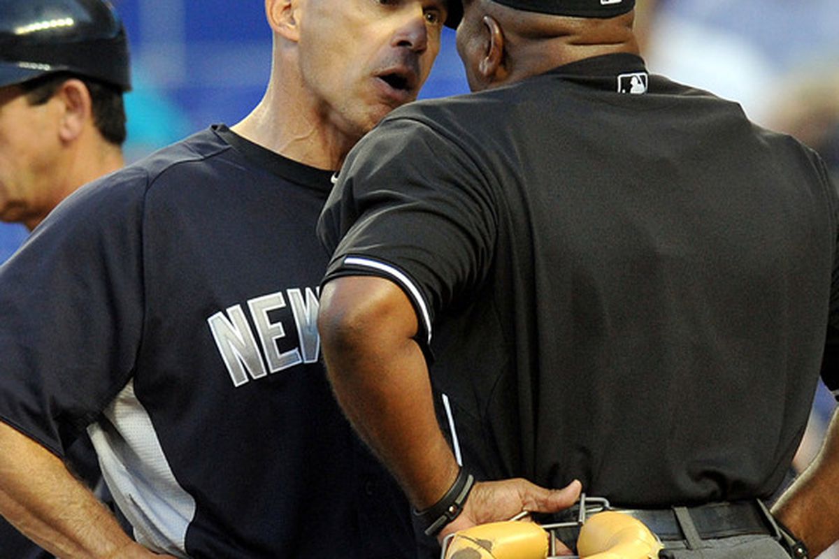 New York Yankees manager Joe Girardi (28), arguing with home plate umpire Laz Diaz (63) during a recent game, appears to be in mid-season form. Steve Mitchell-US PRESSWIRE