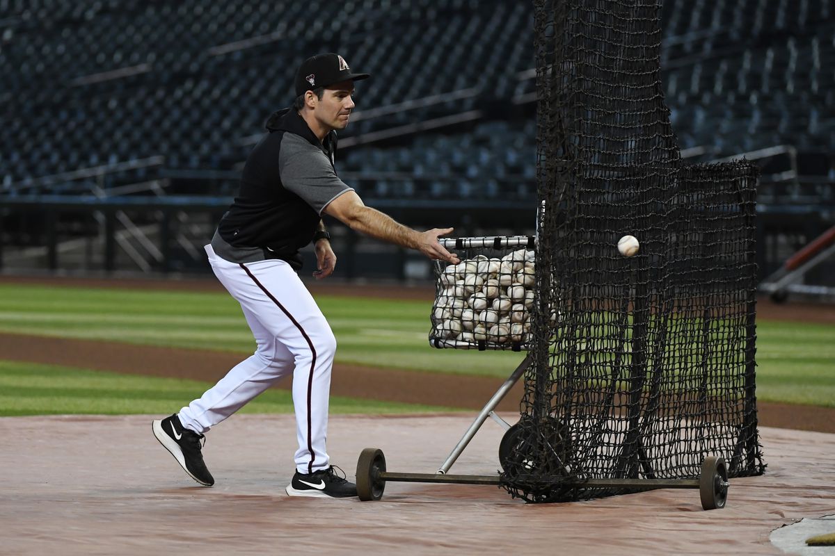 Co-Hitting coach Drew Hedman tosses balls in batting practice.