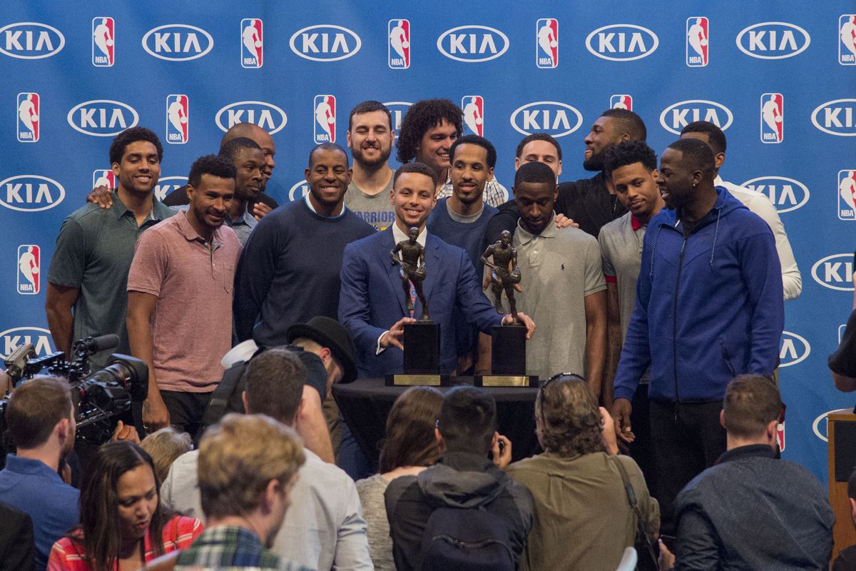 Stephen Curry accepts his second Most Valuable Player trophy, a unanimous selection.