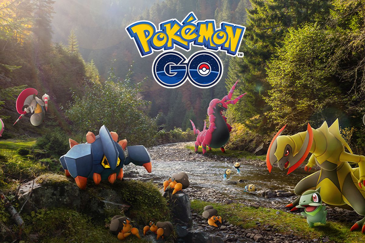 Several Pokémon like Axew and Boldore play around a stream