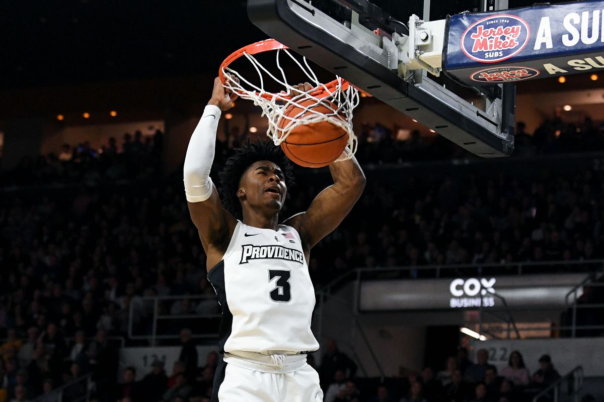 Providence Friars guard David Duke dunks and scores against the Marquette Golden Eagles during the second half at the Dunkin Donuts Center.