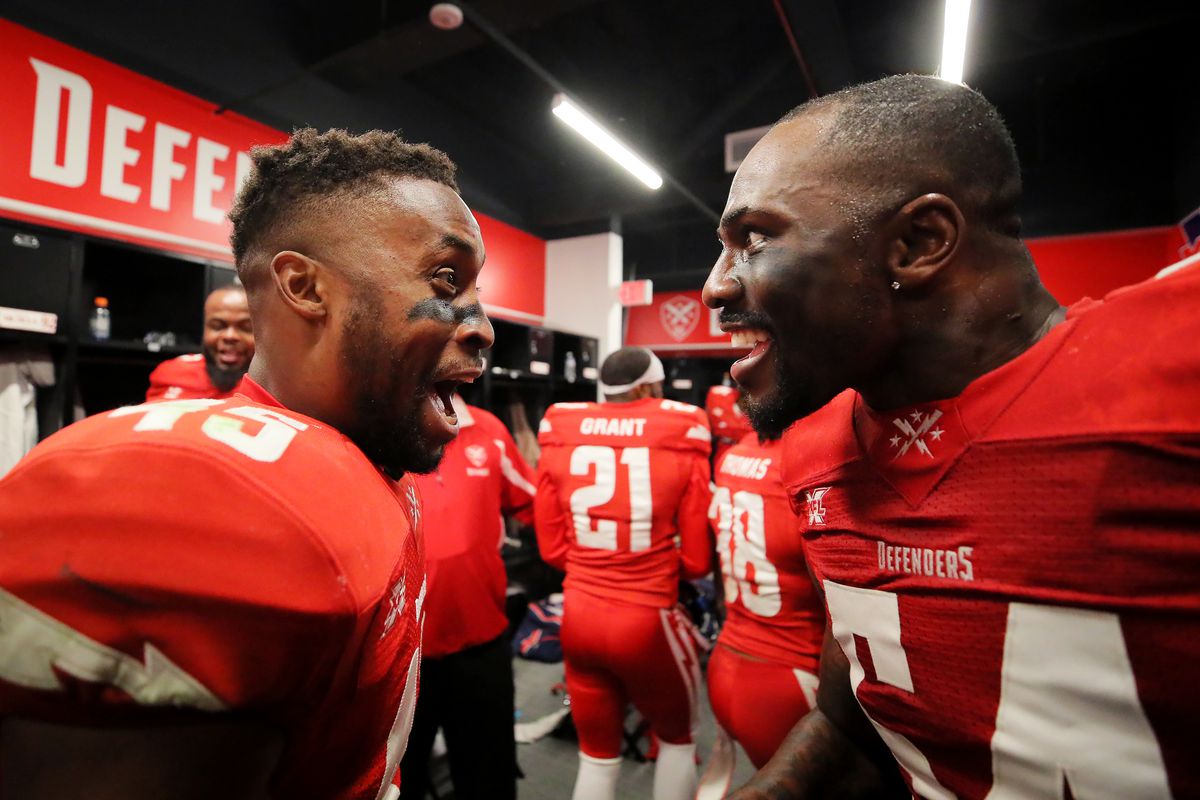 Rahim Moore #45 and Jonathan Massaquoi #54 of the DC Defenders celebrate after the XFL game against the St. Louis BattleHawks at Audi Field on March 8, 2020 in Washington, DC.