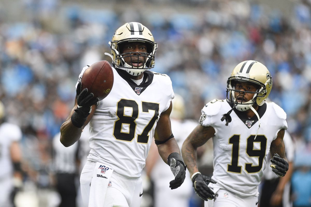 New Orleans Saints tight end Jared Cook celebrates with wide receiver Ted Ginn after making a touchdown catch in the second quarter at Bank of America Stadium.