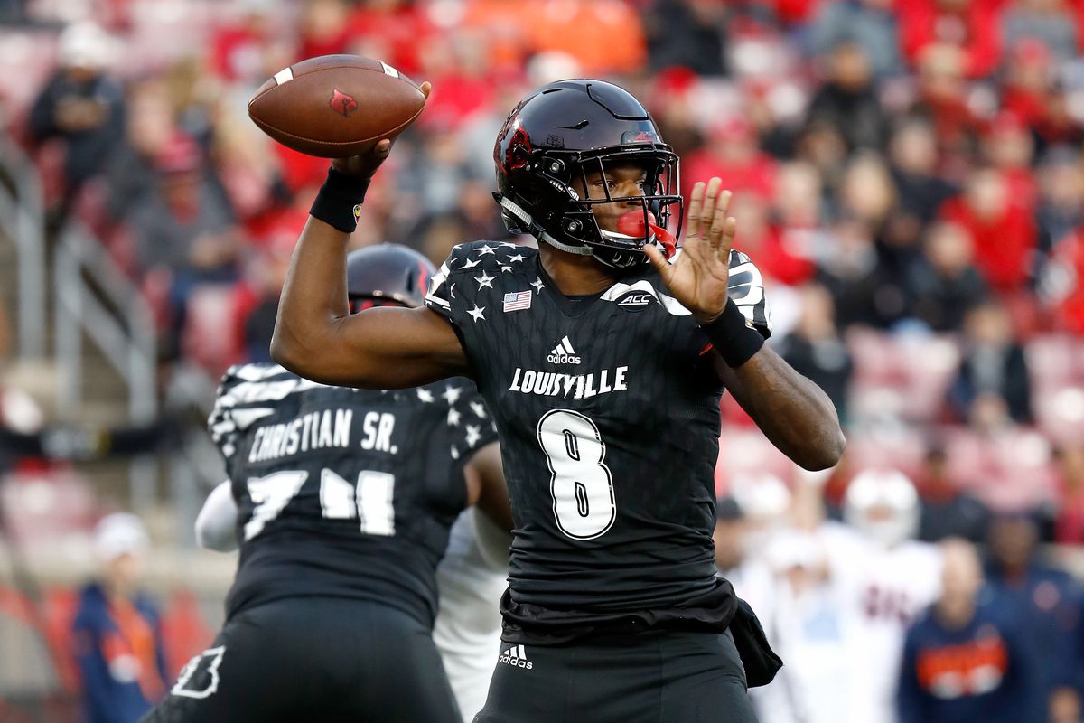 LOUISVILLE, KY - Louisville Cardinals quarterback Lamar Jackson (8) winds up to pass against the Virginia Cavaliers defense at Papa John’s Cardinal Stadium.