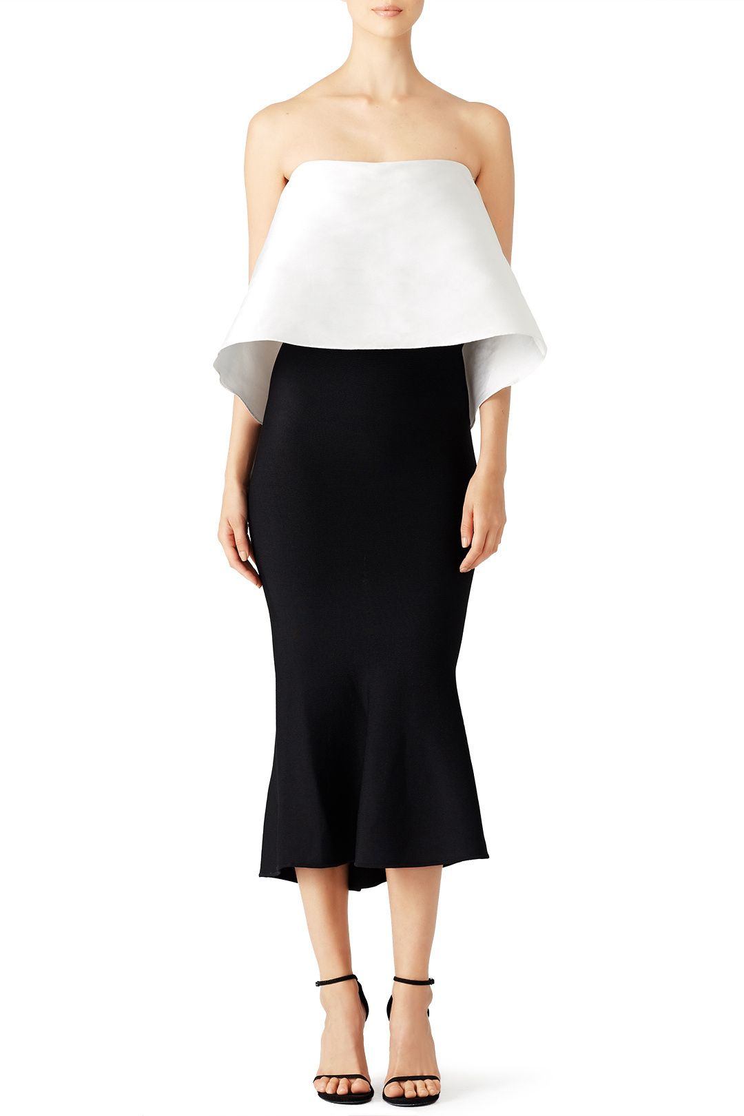 A black dress with a white peplum top