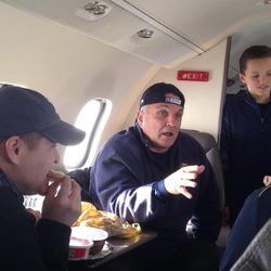 Rudy Ruettiger has a conversation with friends while traveling to the 2013 BYU-Notre Dame football game in South Bend, Indiana.