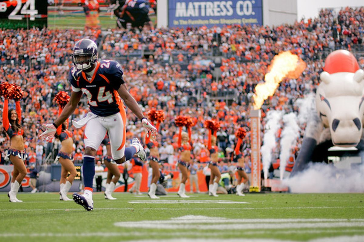 DENVER - OCTOBER 24:  Cornerback Champ Bailey #24 of the Denver Broncos runs onto the field before taking on the Oakland Raiders at INVESCO Field at Mile High on October 24 2010 in Denver Colorado. (Photo by Justin Edmonds/Getty Images)