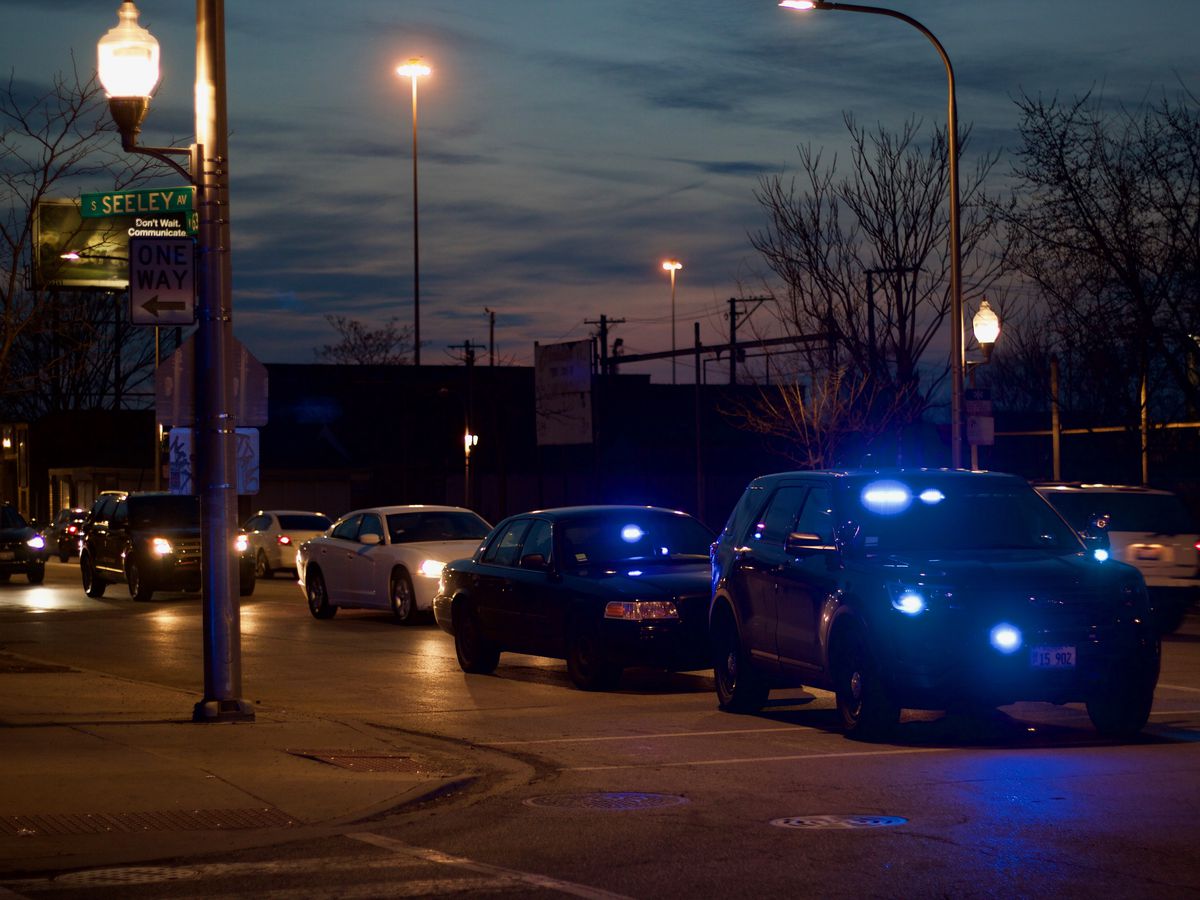 Police swarmed the scene of a drive-by shooting at 63rd and Seeley where at least six people were shot, including two children. | Matt Hendrickson/Sun-Times photo