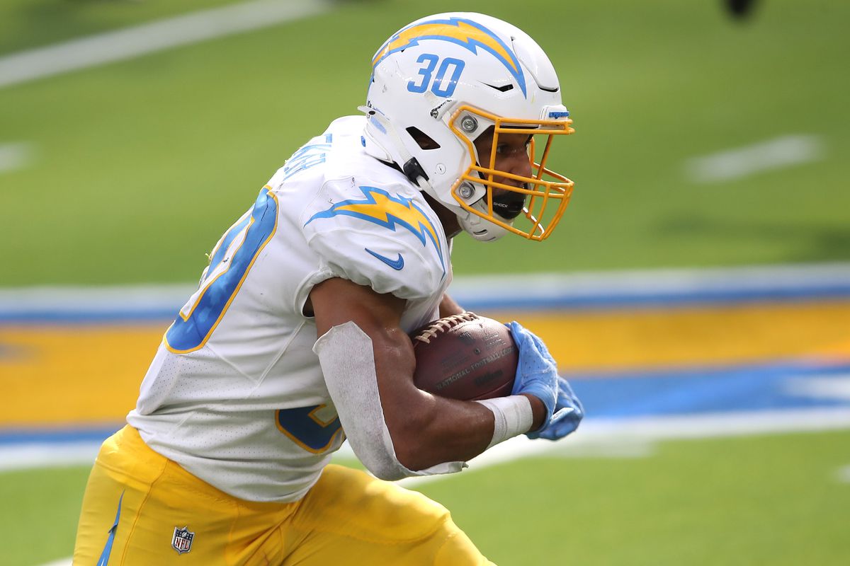 Austin Ekeler #30 of the Los Angeles Chargers runs the ball during the second half of a game against the Carolina Panthers at SoFi Stadium on September 27, 2020 in Inglewood, California.