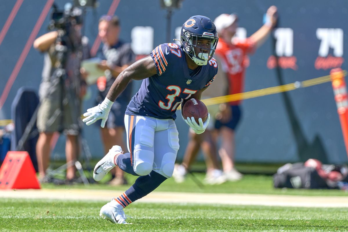 Chicago Bears running back CJ Marable (37) runs with the football in warmups during a preseason game between the Chicago Bears and the Miami Dolphins on August 14, 2021 at Soldier Field in Chicago, IL.