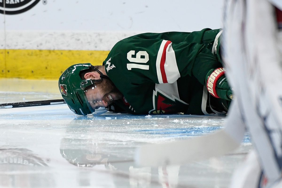 ST PAUL, MN - MARCH 16: Jason Zucker #16 of the Minnesota Wild lays on the ice after an injury during the second period of the game against the New York Rangers on March 16, 2019 at Xcel Energy Center in St Paul, Minnesota. Zucker left the game temporaril
