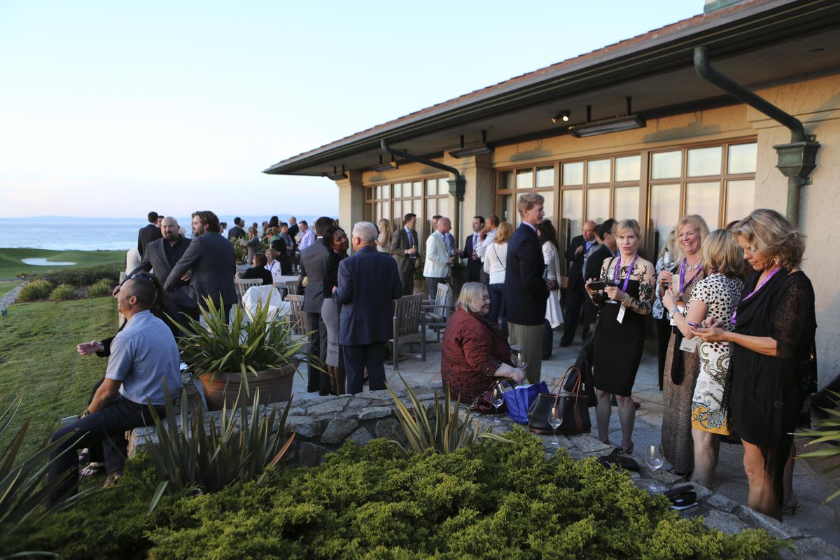 A crowd drinks wine at Pebble Beach Food &amp; Wine
