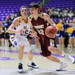 Viewmont's Cole Huish drives past Taylorsville's Crosby Bringhurst as they play Monday, Feb. 23, 2015, in the first round of the 5A boys basketball tournament at Weber State in Ogden.
