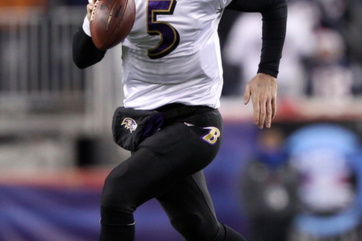 FOXBORO, MA - JANUARY 22:   Joe Flacco #5 of the Baltimore Ravens runs with the ball against the New England Patriots during their AFC Championship Game at Gillette Stadium on January 22, 2012 in Foxboro, Massachusetts.  (Photo by Elsa/Getty Images)