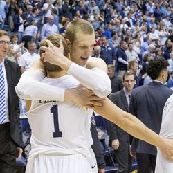 BYU's Chase Fischer (1) and Nate Austin share a hug following the Cougars' 80-77 victory over Virginia Tech on Friday, March 18, 2016, at the Marriott Center in their NIT second-round matchup. 