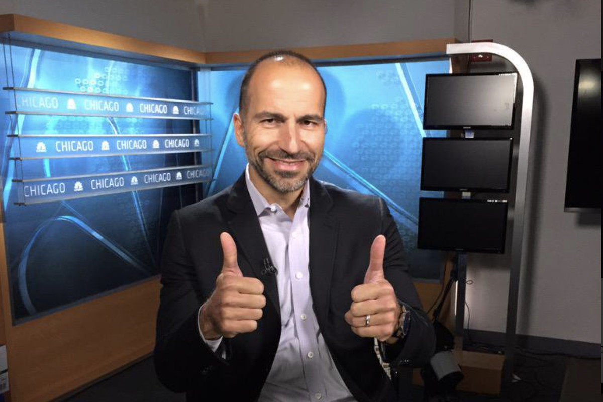 Dara Khosrowshahi smiles and gives two thumbs up on the set of a TV new program.