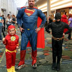Tavish Place, as Flash, Jeff Place, as Superman, and Atticus Place, as Batman, attend Comic Con at the Salt Palace Convention Center in Salt Lake City on Saturday, Sept. 7, 2013.