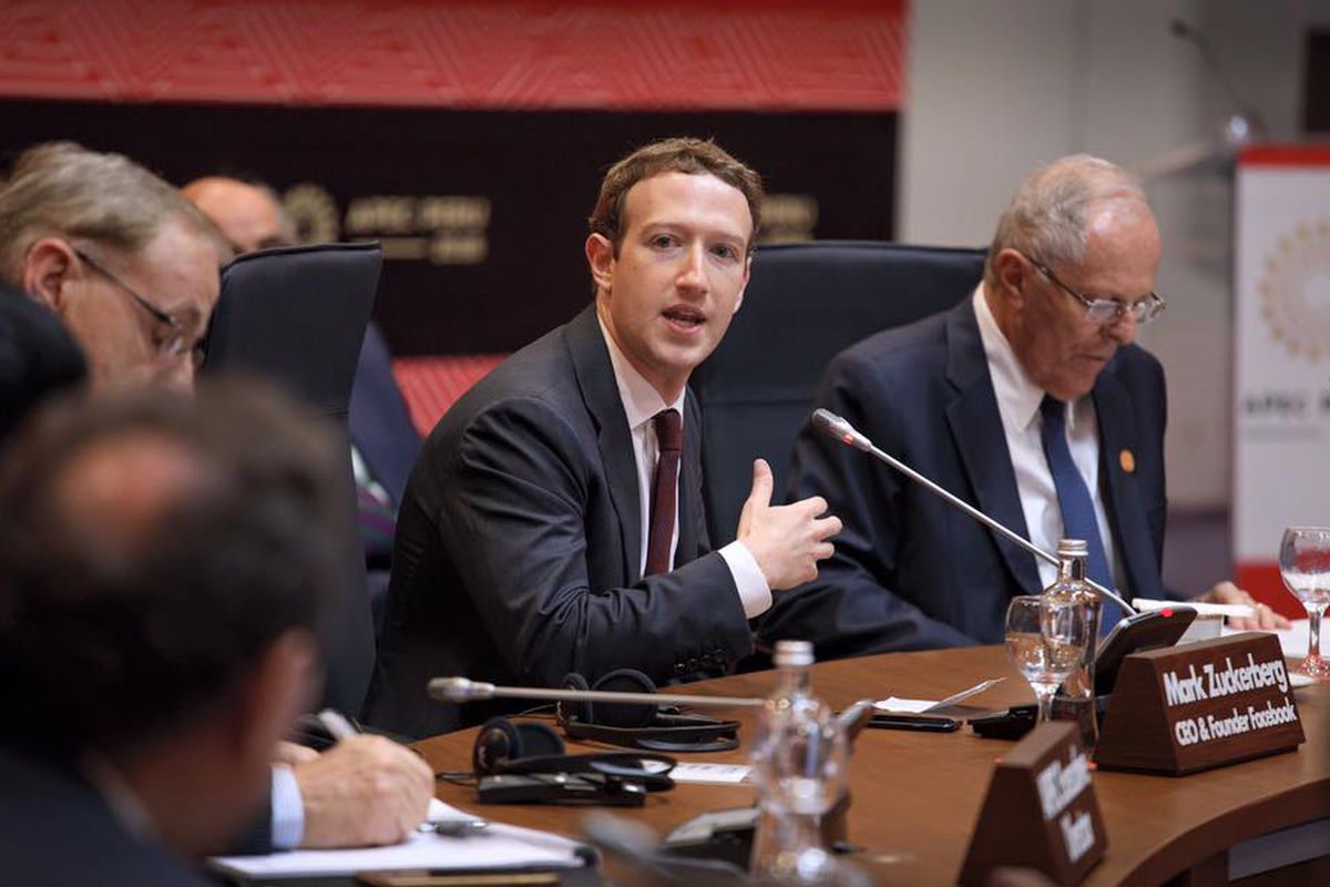 Facebook CEO Mark Zuckerberg in a suit and tie, speaking at a hearing.