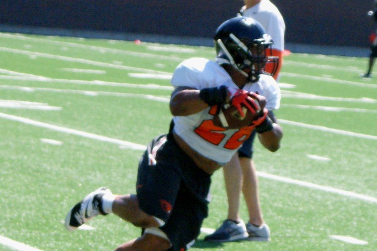 Terron Ward takes a pass and turns it upfield at Oregon St.'s practice today.