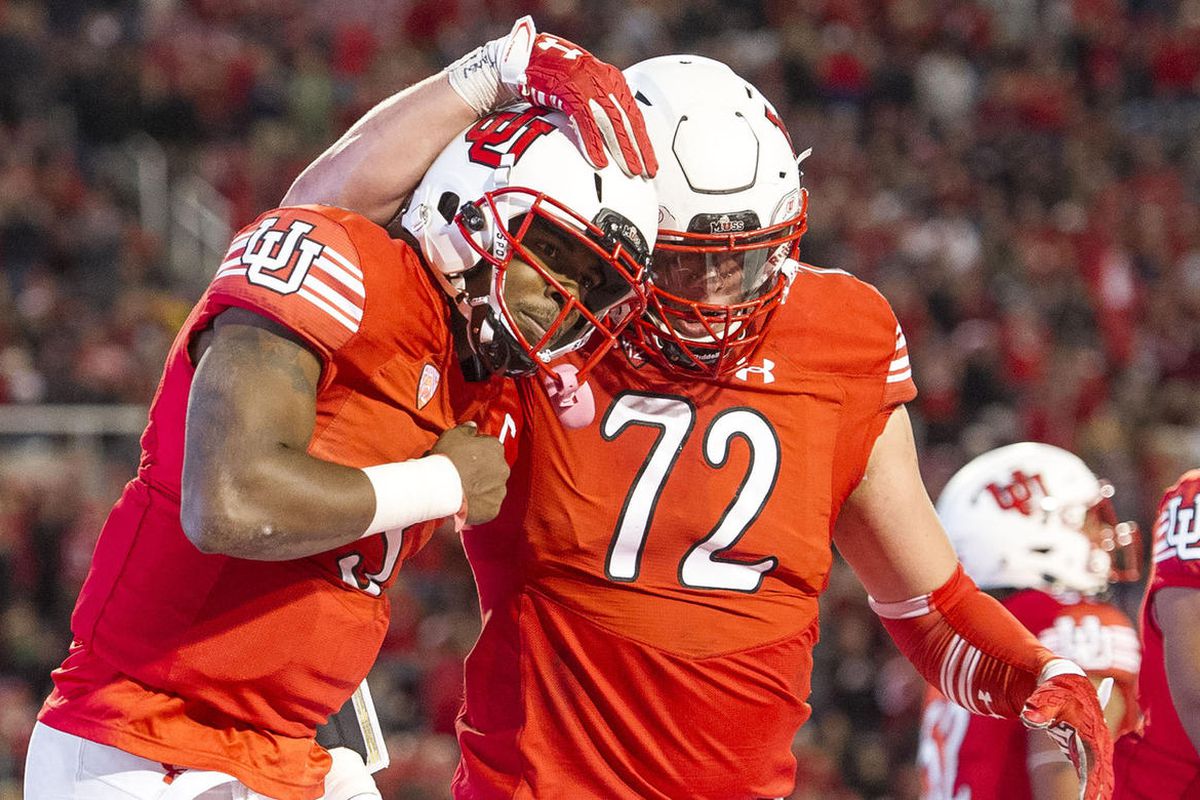 Utah quarterback Troy Williams (3) celebrates his touchdown with offensive lineman Garett Bolles (72) during the second half of an NCAA college football game in Salt Lake City on Sunday, Oct. 8, 2016. Utah battled back from a first-half deficit to defeat 