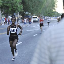 Atalelech Asfaw runs the Deseret News 10K race that started in Research Park and ended in Liberty Park in Salt Lake City Saturday.