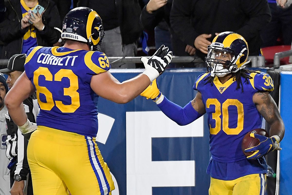 Running back Todd Gurley and offensive guard Austin Corbett of the Los Angeles Rams celebrate Gurley’s touchdown in the fourth quarter of the game against the Seattle Seahawks at Los Angeles Memorial Coliseum on December 08, 2019 in Los Angeles, California.