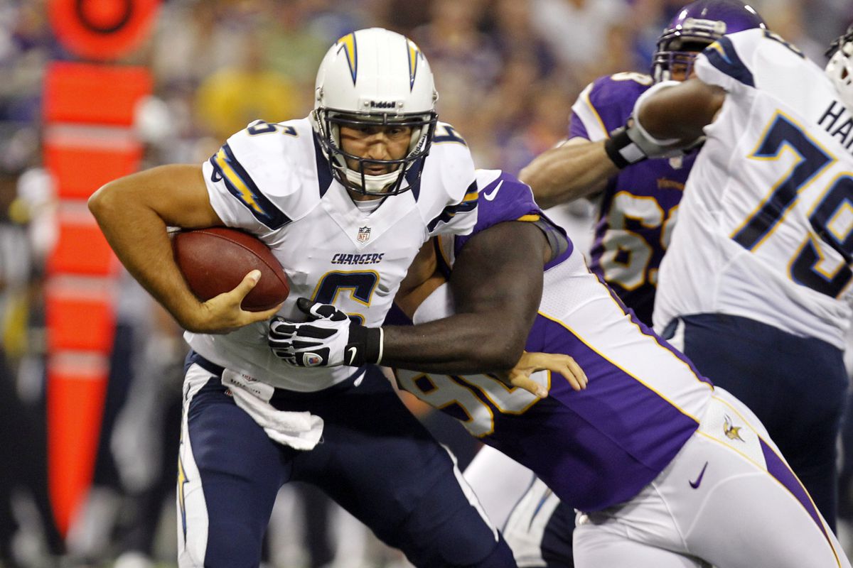 Aug 24, 2012; Minneapolis, MN, USA; Minnesota Vikings defensive tackle Fred Evans (90) sacks San Diego Chargers quarterback Charlie Whitehurst (6) for a 7 yard loss in the first quarter at the Metrodome. Mandatory Credit: Bruce Kluckhohn-US PRESSWIRE