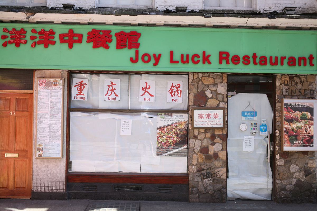 The front of Joy Luck restaurant on Gerrard Street in Chinatown, with green-and-red signage