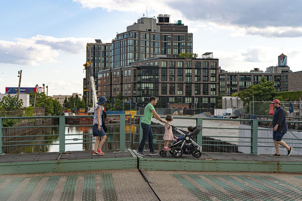 A family crosses the Union St. bridge over the Gowanus canal in the area proposed for rezoning.