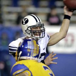 Brigham Young quarterback Riley Nelson (13) throws a pass against San Jose State in the first quarter of an NCAA college football game in San Jose, Calif., Saturday, Nov. 17, 2012. (AP Photo/John Storey)
