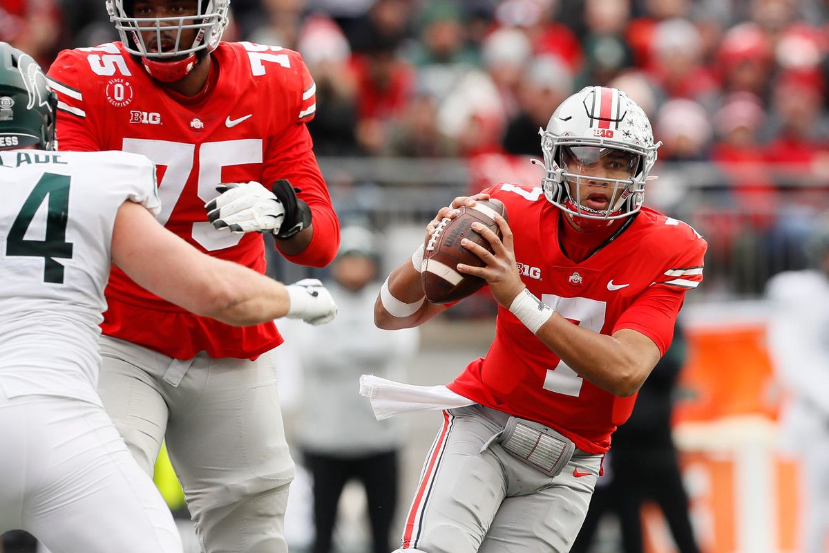 Ohio State Buckeyes quarterback C.J. Stroud (7) scrambles out of the pocket during the third quarter of the NCAA football game against the Michigan State Spartans at Ohio Stadium in Columbus on Saturday, Nov. 20, 2021.