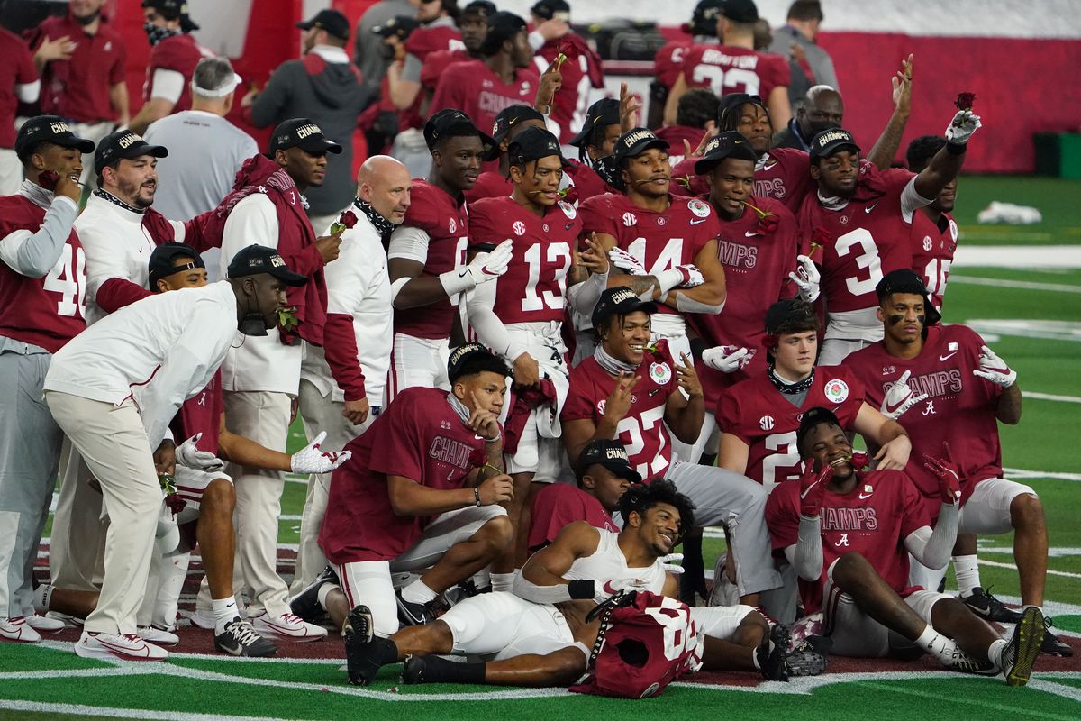The Alabama Crimson Tide pose for a group photo after they defeated the Notre Dame Fighting Irish during the Rose Bowl at AT&amp;T Stadium