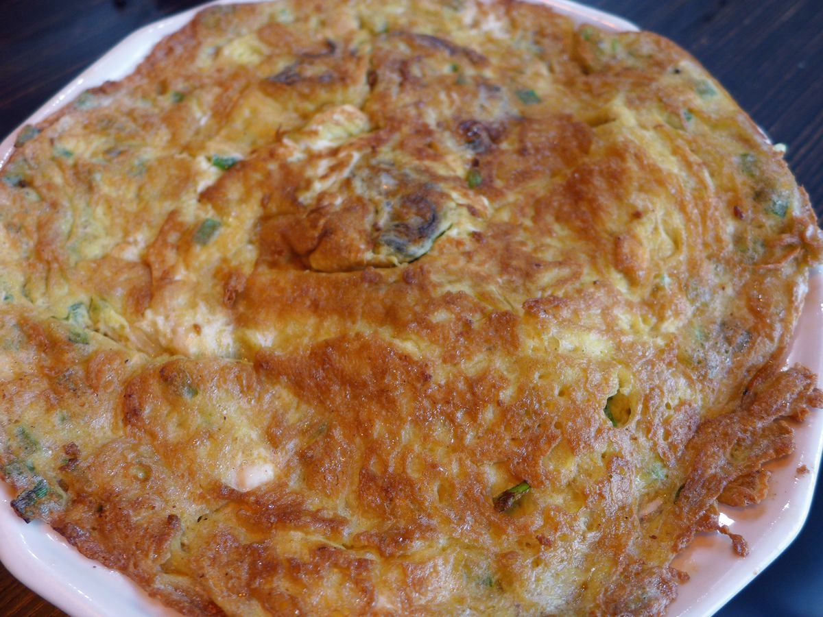 A round brown omelet.