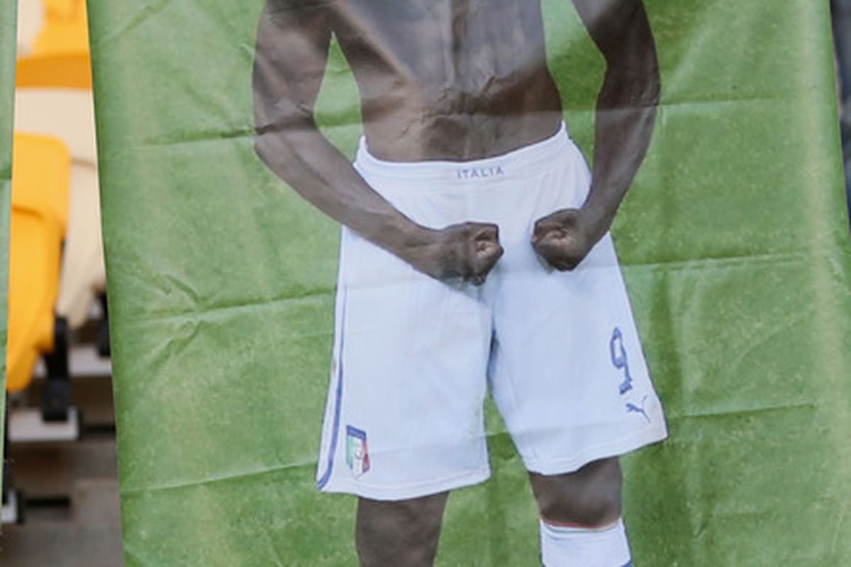 KIEV, UKRAINE - JULY 01:  An Italy fan poses with a Mario Balotelli cut out  prior to the UEFA EURO 2012 final match between Spain and Italy at the Olympic Stadium on July 1, 2012 in Kiev, Ukraine.  (Photo by Alex Livesey/Getty Images)