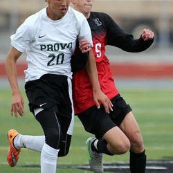 Provo and Alta players battle for possession in a high school soccer game in Provo, Tuesday, March 29, 2016.