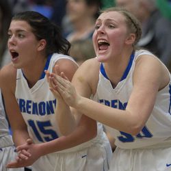 Fremont's Mazzie Melaney (15) and Berkley Larsen (30) cheer during Fremont's 48-46 win over Riverton in the Class 6A state quarterfinals at Salt Lake Community College in Taylorsville on Thursday, Feb. 22, 2018.