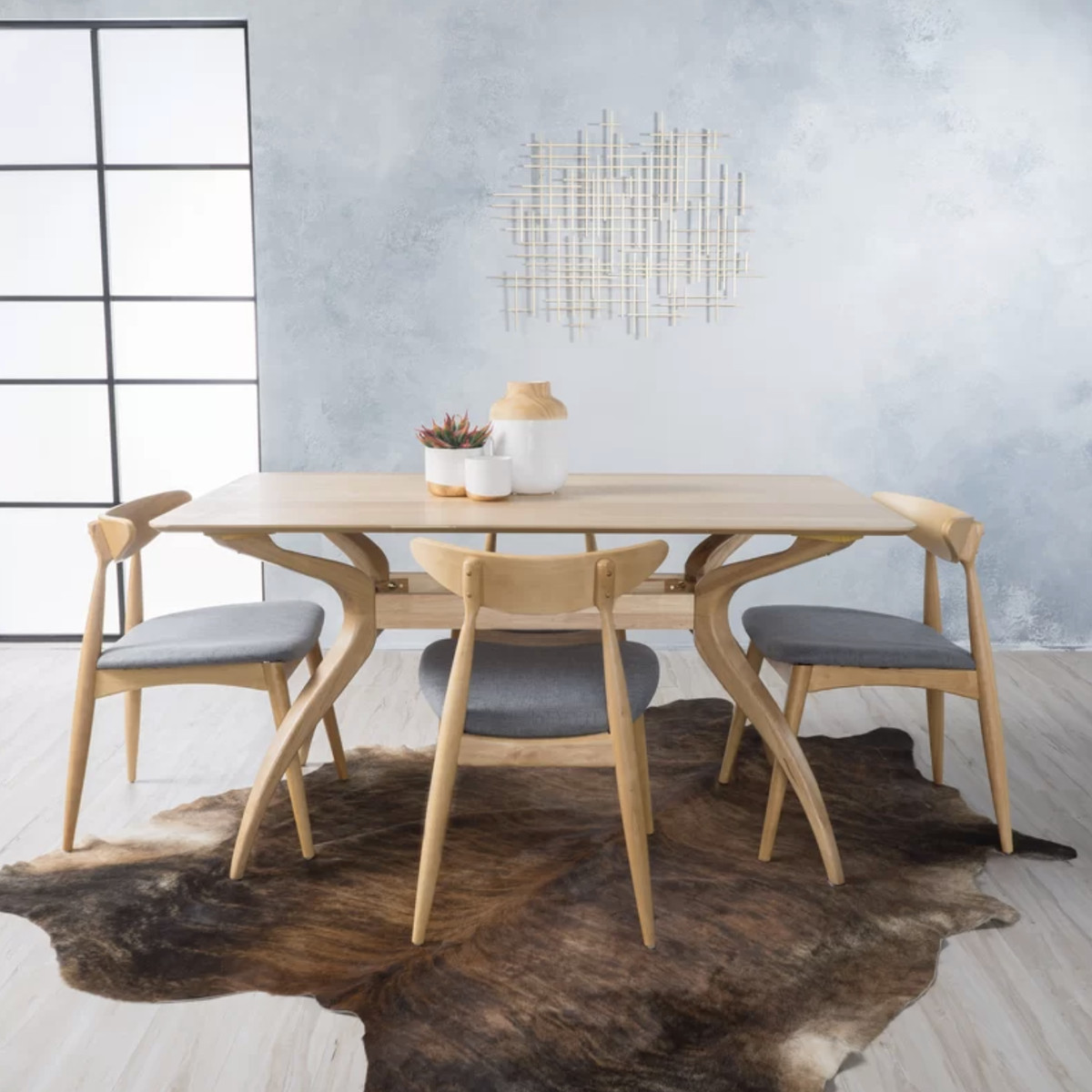 A wooden dining table with four matching chairs. 