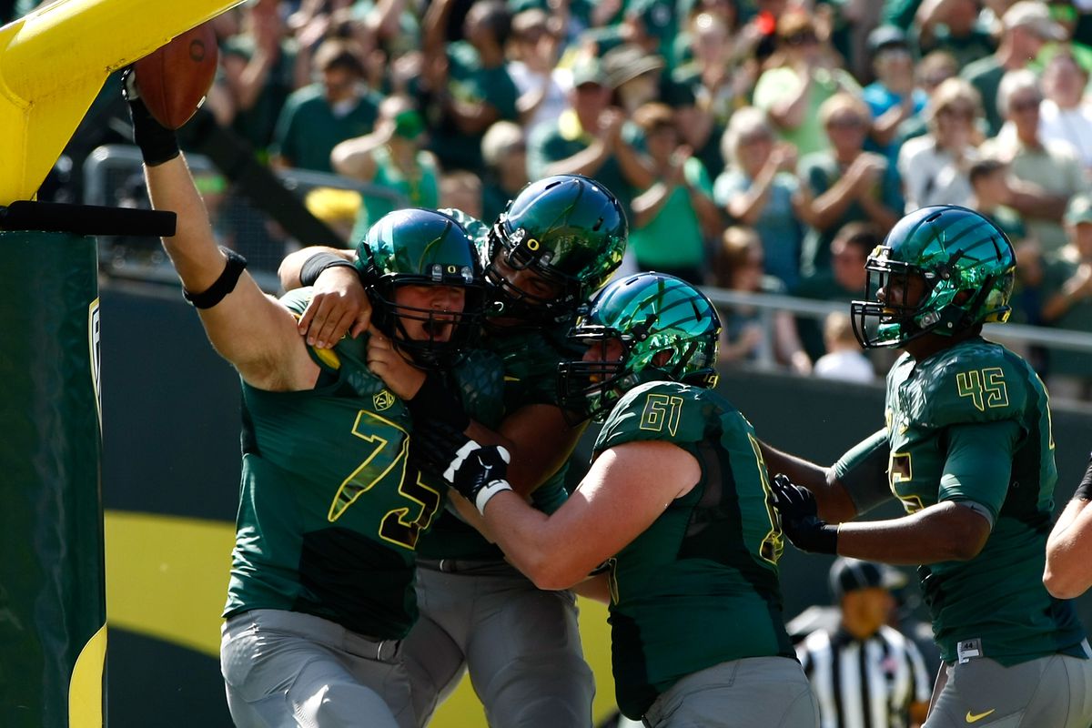 Jake Fisher #75 of the Oregon Ducks celebrates a fumble recovery for a touchdown against the Tennessee Tech Golden Eagles on September 15, 2012 at the Autzen Stadium in Eugene, Oregon.
