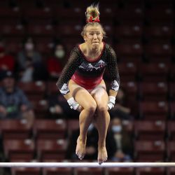 The University of Utah’s Abby Paulson competes on the uneven bars against Brigham Young University, Utah State University and Southern Utah University in the Rio Tinto Best of Utah NCAA gymnastics meet at the Maverik Center in Salt Lake City on Friday, Jan. 7, 2022. Utah won.