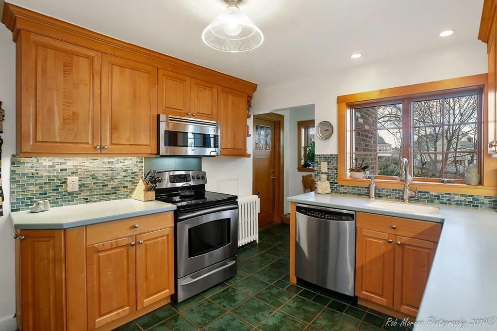  A kitchen with two counters across from each other. 