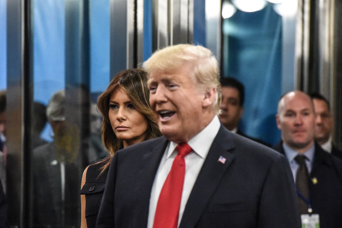 First Lady Melania Trump stands behind her husband, President Donald Trump, on September 25, 2018 in New York City