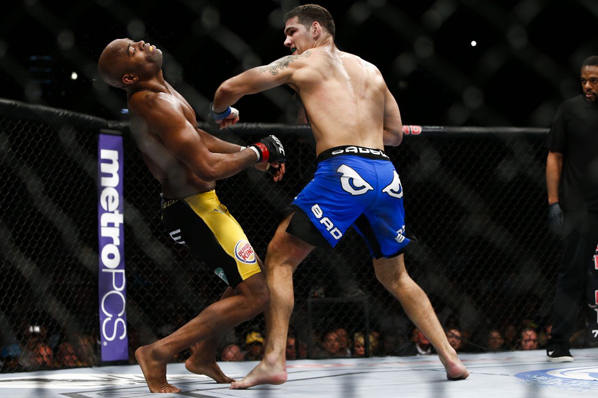 Chris Weidman knocks out Anderson Silva to win the UFC title at UFC 162.