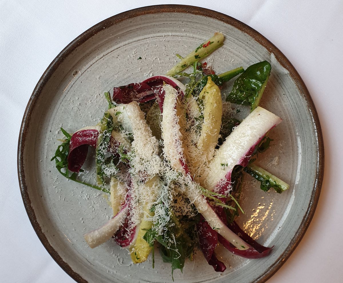 A radicchio salad on a ceramic plate at The French House, Soho