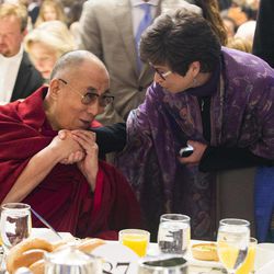 Valerie Jarrett, senior adviser to President Barack Obama, right, talks with the Dalai Lama during the National Prayer Breakfast in Washington, Thursday, Feb. 5, 2015. The annual event brings together U.S. and international leaders from different parties and religions for an hour devoted to faith. 