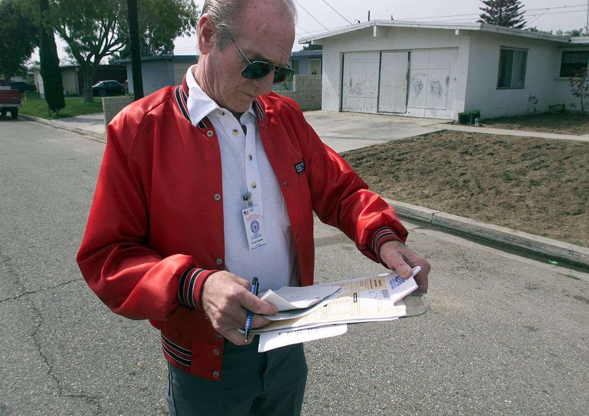A census worker going door-to-door to conduct follow-up interviews for the 2010 census.