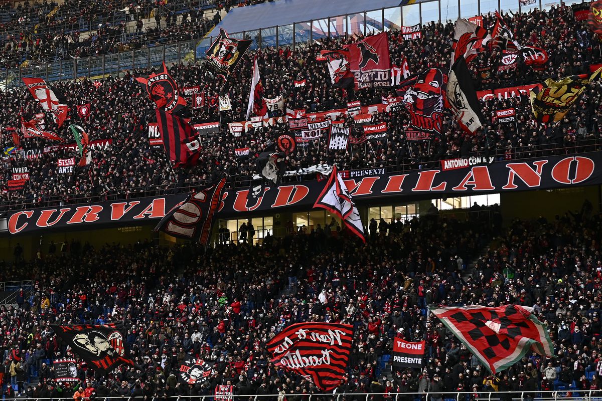 Fans of AC Milan in sector ‘Curva Sud’ show their support...